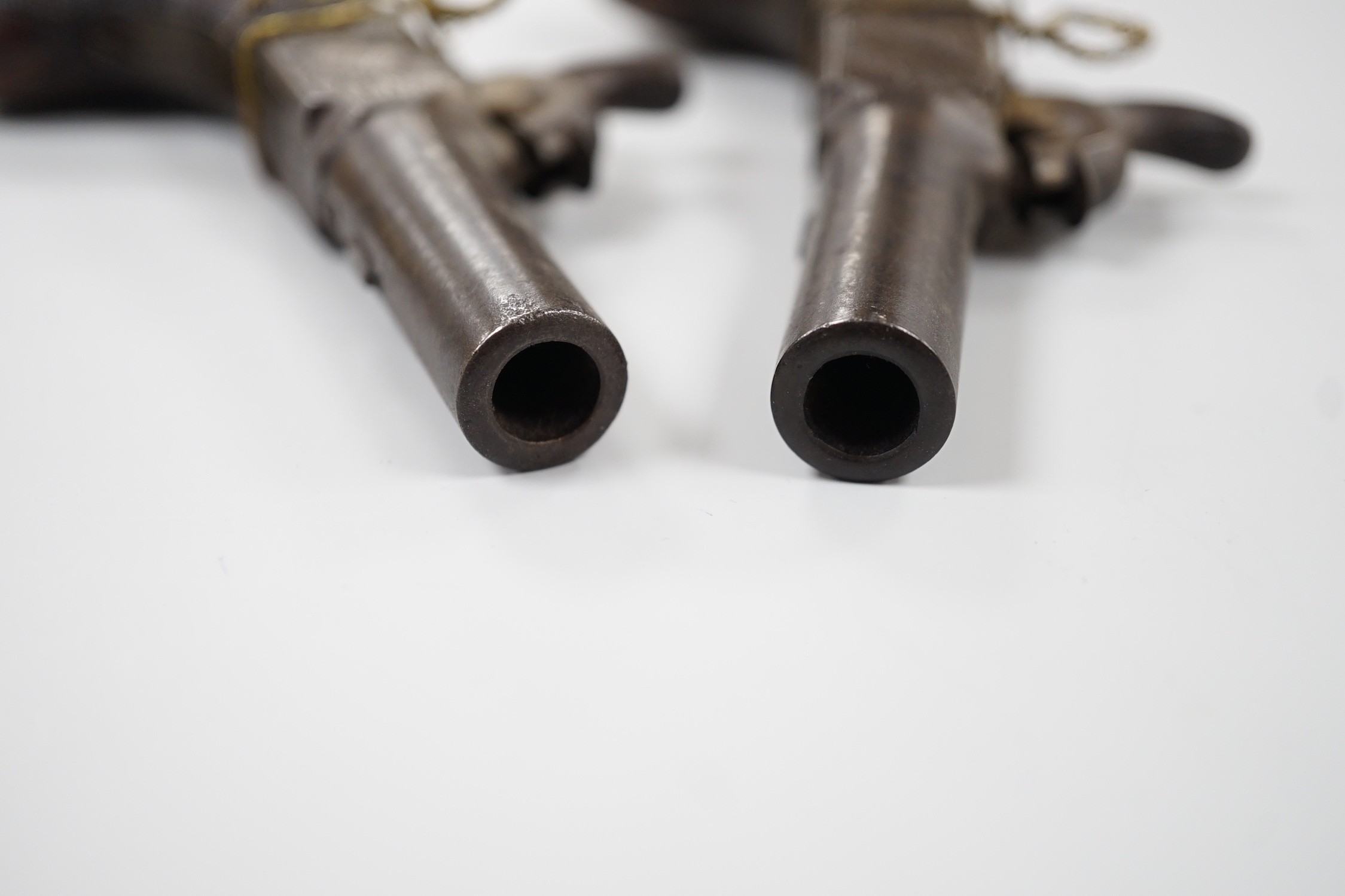 A pair of 19th century Smith of London percussion cap muff pistols, 12.5cm